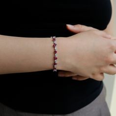 Behold the Ivy Ruby Bracelet by Ruchi New York! This exquisite piece of fine jewelry is a must-have for any woman looking to make a statement. The bracelet features a delicate and modern design that is both playful and versatile. The extra slim band is adorned with mixed shape stones, including 8.30 carats of ruby and 0.94 carats of diamonds, making it a perfect accessory to dress up any outfit.The Ivy Ruby Bracelet is more than just a piece of jewelry; it's a statement of style and sophisticati Flexible Diamond Bracelet Fine Jewelry, Elegant Gemstone Bracelet With Cubic Zirconia, Elegant Sterling Silver Flexible Bracelet, Elegant Flexible Sterling Silver Bracelet, Gemstone Tennis Bracelet For Wedding, Wedding Gemstone Tennis Bracelet, Diamond Bangle Bracelet With Gemstones, Exquisite Jubilee Diamond Bracelet, Elegant Sterling Silver Gemstone Bracelet For Wedding