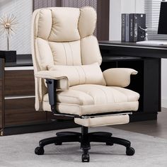 a white office chair sitting in front of a desk