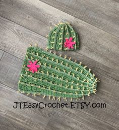 a crocheted cactus hat and diaper cover with pink flowers on the top