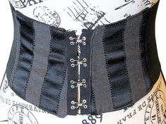 CHRISTMAS DELIVERY CUT OFF: DECEMBER 11, 2024 Please place your orders before this date to ensure delivery by Christmas. The VM Black Stripe Tapestry Waist Belt 💋This black tapestry renaissance belt is lined with either a 100% cotton canvas or broad cloth which is a cotton poly bend. The back of the gothic corset belt is a stretch, thick elastic that allows you to move and bend with ease while still snatching your waist and giving the illusion of wearing a corset. The goblincore underbust corse Black Medieval Underbust Corset Belt, Black Fitted Medieval Corset Belt, Black Steampunk Corset Belt For Larp, Black Gothic Corset Belt For Larp, Gothic Black Corset Belt For Larp, Medieval Black Corset Belt For Festivals, Black Steampunk Corset Belt For Festival, Black Medieval Corset Belt For Larp, Steampunk Black Corset Belt With Belt Loops