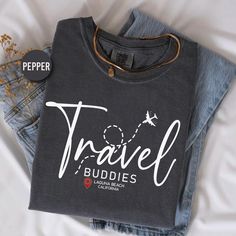 Comfort Colors T-Shirt for Adults - Personalized "Travel Buddies" Design - Travel-Themed Custom Shirt Celebrate your journeys with this Comfort Colors t-shirt featuring a personalized "Travel Buddies" print. Add your favorite location to create a fun and stylish keepsake for your travels with friends or family. 🛍️ HOW TO ORDER: 1️⃣To begin, select the desired product type and size from the drop-down menu. 2️⃣Next, choose the primary color and brand. 3️⃣Then, choose the desired quantity. 4️⃣Finally, click on the "Add to Cart" button. 🌟🌟If you're interested in purchasing another product with a different design or size, simply add it to your cart from the product page. ♦️ T-SHIRT: - 6.1 oz./yd² (US), 10 oz/L yd (CA), 100% ring-spun cotton, 30 singles - Garment dyed for that lived in feel a Cotton Letter Print Travel Tops, Cotton Travel Tops With Letter Print, Graphic Tee With Crew Neck For Travel, Cotton Letter Print Tops For Travel, Cotton Crew Neck T-shirt For Travel, Travel Buddies, 30 And Single, Custom Shirt, Travel Themes