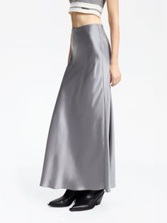 MO&Co. Women's High Rise Satin Maxi Skirt Introducing our satin skirt, crafted from a luxurious blend of acetate and polyester. The high waist and flowing silhouette are effortlessly elegant, while the convenient side zipper allows for easy wear. Create a chic and casual look by pairing it with a tank top or cozy sweater. Features : - High waist, flowy maxi silhouette- Ruched pleated details on the back- Soft and smooth triacetate blend materials Code: MBD1SKT033The back length of size S is 94.5 Spring Formal Satin Maxi Skirt, Chic Silk Maxi Skirt With Satin Finish, Flowy Silk Skirt With Satin Finish, Chic Silk Skirt With Satin Finish, Silk Flowy Skirt For Night Out, Silk Skirt For Night Out, Flowy Silk Maxi Skirt With Satin Finish, Silk Flowy Maxi Skirt, Silk Flowy Full-length Skirt