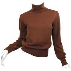 The perfect fall and winter sweater! 1990s ESCADA by MARGARETHA LEY rich caramel brown wool turtleneck sweater! Smart tailored fit is stylish while keeping you warm. Super soft virgin wool. Can easily be dressed up or down. Great with jeans, trousers or a skirt. This would look amazing with a black leather pencil skirt! In great unworn condition. Made in Germany Marked Size 34 Measurements: (lots of stretch) 36-40 inch bust 24-32 inch waist Throwback Outfits, Fur Blazer, Dior By John Galliano, Brown Turtleneck, Black Leather Pencil Skirt, Academia Outfits, Statement Blouse, Academia Fashion, Pull Oversize