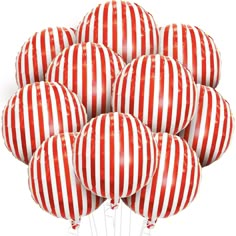 a bunch of red and white striped balloons