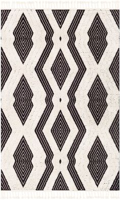 a black and white rug with an abstract design