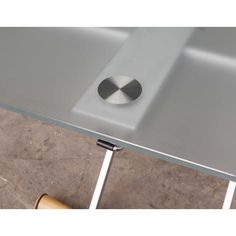 a square metal table with a hole in the middle