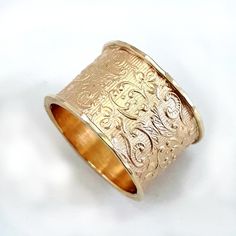 The lacy, delicate pattern is what makes this wide 10k gold ring a popular choice. It's a gorgeous wide gold ring, perfect for a wedding band, and is especially suited to a woman with long, elegant fingers. Alternative base: the ring is available with a sterling silver base: http://etsy.me/2roZkco Instead of 10k gold, the ring is also available in 14k gold. Please contact us. Width: 0.54 inch / 13.5 mm Thickness: 0.06 inch / 1.5 mm This listing is for sizes 4-11- Just convo me your size. For oth Heirloom Yellow Gold Wide Band Ring, Heirloom 14k Gold Wide Band Ring, Heirloom Engraved Ring With Decorative Wide Band, 14k Gold Filigree Wedding Ring With Decorative Band, Heirloom 14k Gold Wide Band Wedding Ring, Elegant Wide Band Ring With Decorative Band, Elegant Yellow Gold Wide Band Ring With Decorative Band, Elegant Wide Band In Yellow Gold, 14k Gold Heirloom Wide Band Engraved Ring