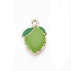 Juicy! Enamel Lime Charm.  Measures  3/4 x 1/2 inch. Gold plated Zinc alloy, lead-free. Comes with a jump ring not shown in pictures.  **Get this Charm for FREE with the purchase of any charm bracelet  Good for charm bracelets, handbag charms, zipper pulls, and pendants, key rings, keychains and earrings.  All items in stock and ships from Tennessee. Green Pendant Charms For Gifts, Green Charms With Lobster Clasp For Gift, Green Enamel Charm Jewelry, Green Enamel Jewelry With Charms, Nickel-free Green Charms For Gifts, Hypoallergenic Green Enamel Jewelry, Nickel Free Enamel Charms For Jewelry Making, Nickel-free Enamel Charms For Jewelry Making, Nickel Free Enamel Pendant Charms