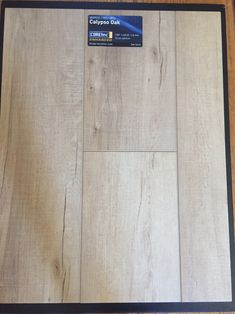 a wooden floor with a credit card on it