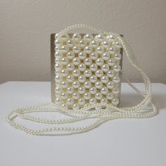 This stunning crossbody handbag is crafted with delicate pearl design and pearl straps. Enjoy effortless style and endless compliments with this elegant bag. Feel beautiful and confident with the perfect accessory for your look. Elegant Bags With Adjustable Strap, Elegant Evening Bag With Adjustable Strap, Elegant Evening Shoulder Bag With Adjustable Strap, Elegant Clutch Shoulder Bag With Adjustable Strap, Elegant Shoulder Clutch Bag With Adjustable Strap, Elegant Crossbody Evening Bag With Adjustable Strap, Chic Pearl Evening Bag As Gift, Chic Pearl Evening Bag For Gift, Formal Crossbody Bag With Pearl Handle