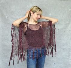 Burgundy hand-knit linen poncho with fringe, Knitted summer cape in boho style, Loose knit beach cover-up A hand-knit linen poncho with fringe is the perfect summer accessory.  This loose-knit poncho is very functional, it could be worn with jeans, a summer dress, or a bikini.  This beautiful garment is excellent over a light dress. It's the perfect cover-up for the summer beach wedding. Poncho is made of linen  One size - S/M/L Color: burgundy (linen yarn), black (linen yarn), navy blue  (linen Beach Poncho With Open Knit One Size, Beach Poncho In Open Knit One Size, Beach Open Knit Poncho One Size, Open Knit Summer Beach Poncho, Summer Beach Open Knit Poncho, One Size Beach Shawl With Fringe, One Size Tasseled Shawl For The Beach, Beach Shawl With Tassels One Size, Beach Shawl With Tassels