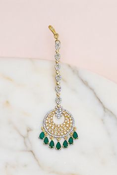 Delicate AD/CZ Green Color Maang ka Tikka with Silver plated.  Please refer to the picture for size. Height = 95 mm || Width = 11 mm If you have any other questions, feel free to contact us. Check out our other listings at: https://www.etsy.com/shop/mdbeadworks JEWELLERY CARE Protect your Jewellery from Sharp Blows, Scratches, and Extreme Temperatures. Avoid Contact With Perfumes, Sprays, Chemicals, and Water. Keep your Jewellery in a Clean, Dry, and Airtight Box. Wipe it using a Soft Cloth Regu Luxury Temple Jewelry Tikka With Meenakari, Luxury Temple Jewelry Tikka As Gift, Luxury Stone Work Tikka For Celebration, Forehead Jewelry, Jewelry Pakistani, Pakistani Jewelry, Party Wear Indian Dresses, Fun Quotes, Stone Gold