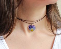 Violet flowers have the ability to hear other people's thoughts. This flower necklace choker, part of my pansy jewelry, has a beautiful story behind. Do you want to hear it? Miguel was a shy boy who had no friends. His only friend was a pansy flower that grew in a corner of his village. When Miguel talked to her, she listened to his words and thoughts, and little by little that beautiful flower gave Miguel love and self-esteem to fill him with happiness and friends 🌸 This flower necklace choker Adjustable Flower-shaped Jewelry For Valentine's Day, Adjustable Flower Shaped Jewelry For Valentine's Day, Adjustable Flower Necklaces For Mother's Day, Adjustable Flower Clavicle Chain Jewelry, Adjustable Clavicle Chain Jewelry With Flower Shape, Flower Charm Choker As A Gift, Flower Shaped Choker With Flower Charm As Gift, Floral Choker With Flower Charm As A Gift, Adjustable Flower Charm Choker