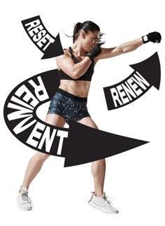 a woman in black top and shorts holding a pair of boxing gloves