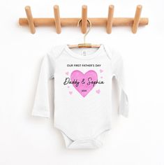 Personalised Father's Day baby bodysuit. This cute little suit will be sure to impress! Bodysuit is 100% cotton.  We design & print our products with care & love! We use the best quality vinyls, inks & transfers on all products. * * * * * * * * * * * * * * * * * * * * * * * * * * * * * SHIPPING: We want to get your product to you as quickly as possible, your purchase will be shipped through Australia post, Express post is available for selection. * * * * * * * * * * * * * * * * * * * * * * * * * Fitted Bodysuit For Birthday And Mother's Day, Pink Cotton Bodysuit As Gift, Pink Cotton Onesie As A Gift, Pink Cotton Onesie As Gift, Cotton Birthday Onesie, Family Matching Cotton Onesie For Mother's Day, Pink Onesie With Letter Print As A Gift, Pink Onesie With Letter Print As Gift, Family Matching Onesie With Name Print For Father's Day