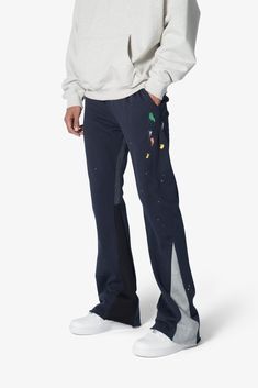 the Contrast Bootcut Sweatpants are designed with a relaxed fit throughout, featuring an elasticized self waist and leg opening, multi-colored paint splatter throughout, and finished with denim and contrasting panels at the inseam and outseam to provide a flare at the leg opening. details relaxed fit flared leg opening 55% cotton 45% polyester model is 6’1, 140 lbs and wears a size medium Bootcut Sweatpants, Leather Moto Pants, Layered Hoodie, Moto Pants, 140 Lbs, Denim Cargo Pants, Fuzzy Cardigan, Denim Patches, Denim Flares