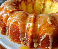 a bundt cake with icing on a white plate