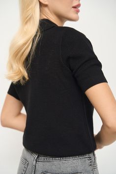 The basic T-Shirt with an original knitted texture and polo collar. It is made of incredibly soft and durable cotton-based material that stretches well and does not restrict movement. The lower cuff can be bent so the T-Shirt will fit high-waisted items. It looks great with jackets and can also be worn as a stand-alone top in warmer weather, complementing your spring and summer looks harmoniously. Cotton V-neck Top With Ribbed Collar, Casual V-neck Polo Shirt With Ribbed Collar, Cotton Knit Top With Ribbed Crew Neck, Versatile Crew Neck Tops With Ribbed Cuffs, Casual Stretch Knit T-shirt, Cotton Sweater With Ribbed Collar And Stretch, Cotton Stretch Sweater With Ribbed Collar, Casual Short Sleeve Textured Knit Sweater, Cotton Sweater With Stretch And Ribbed Collar