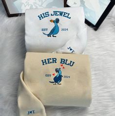 Custom His Blue And Her Jewel Rio Embroidered Sweatshirt, Rio Blue Bird Couple Matching Hoodie, Adult/Youth Embroidered Sweater/Hoodie *Embroidered Sweatshirt/Hoodie*  Maximum Embroidery Sizes Chest center - 6"x6" Left/Right chest - 3.5"x3.5" Sleeve - 2.5"x2.5" Available embroidery position - Chest center Front/Back - Left/Right chest - Left/right sleeve - Neck Material: 8 oz./yd² (US) 13.3 oz./L yd (CA), 50/50 cotton/polyester - Classic fit - Make in US Blue Hoodie With Custom Embroidery, Jewel Rio, Blue Long Sleeve Hoodie With Custom Embroidery, Couples Sweatshirts Embroidery, Blue Cotton Sweatshirt With Custom Embroidery, Embroidery Couple Design Sweater, Blue Custom Embroidered Hoodie, Hoodie Matching Couple, Blue Embroidered Crew Neck Hoodie