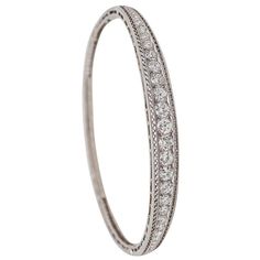 Check out this item from 1stdibs! Marcus & Co. 1910 Edwardian Bangle Bracelet In Platinum With 3.16 Ctw In Diamond: https://www.1stdibs.com/id-j_22599242 Edwardian Bracelet, Iconic Jewelry, Simple Wedding Bands, Edwardian Ring, Edwardian Jewelry, Filigree Pattern, Elegant Bracelet, Natural Earth, Jewelry Maker