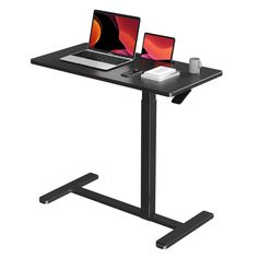 a laptop computer sitting on top of a black desk