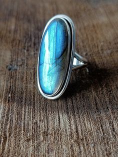 Handmade labradorite bohemian ring , you can wear this ring as a party wear ring .. Title -labradorite stone ring Stone color - blue Stone shape - oval Material - Sterling silver 925 Note - This is natural stone so shade may be little bit different .. we are giving you best quality rings on best price .. contact us for more quantity Bohemian Moonstone Ring With Large Stone, Bohemian Large Moonstone Ring, Blue Labradorite Bohemian Jewelry, Blue Bohemian Crystal Ring, Bohemian Blue Labradorite Jewelry, Bohemian Sterling Silver Moonstone Ring Nickel Free, Bohemian Moonstone Ring With Large Stone For Gift, Bohemian Open Ring Crystal Ring For Healing, Bohemian Adjustable Moonstone Open Ring