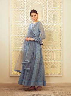 This set features a blue-grey dori embroidered long kurta with dupatta and trouser. Color: Blue Grey Fabric: Silk, Chanderi Jaquard And Georgette Embroidery Details: Gold Dori And Thread Care: Dry ... Grey Anarkali, Kurta Skirt, Kurta With Dupatta, Blouse Yoke, Bridal Trousseau, Long Kurta, Indian Kurta, Casual Tunics, Thread Embroidery