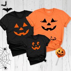 Step into the enchanting world of Halloween with our Pumpkin Face Family Matching Shirt collection. Each shirt is a canvas of creativity, featuring the iconic Jack O' Lantern in a myriad of expressions. Whether you're prepping for a festive family photoshoot or adding a touch of spooky charm to your maternity wardrobe, these Spooky Season Face Tee are the epitome of Halloween spirit. These Halloween Party TShirt are not just apparel; they're a testament to the joy and unity that Halloween brings. Make this Halloween memorable with our Pumpkin Face Family Matching Shirt collection. Join the Jack O' Lantern brigade and let the festivities begin. You can find other sizes of this shirt in the links below. By clicking on the link, you can go to the blank shirt page and write the design you want Halloween Themed Cotton Tops, Cotton Halloween Themed Tops, Themed Cotton Tops For Halloween, Family Matching Halloween T-shirts, Family Matching Halloween T-shirt Crew Neck, Halloween Family Matching Crew Neck T-shirt, Family Matching Halloween Tops With Graphic Print, Family Matching Halloween Graphic Print Tops, Themed Halloween T-shirt With Custom Print