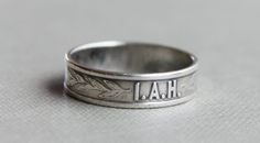 "Gorgeous early 1900's Silver I.A.H. Christian religious ring The initials I.A.H. are embossed on the front of the ring with sprigs of leaves on either side. The initials stand for \"I am His\", in reference to Jesus. This ring went along with a Christian program that started in the late 1800's. This would make a very lovely promise ring! No markings. Tests around 800 silver US Size 4 3/4 Band measures approximately 5mm wide." Antique Engraved Ring Hallmarked, Vintage Engraved Signet Ring With Round Band, Heirloom Engraved Ring For Commemoration With Hallmarks, Vintage Engraved Signet Ring For Commemoration, Antique Engraved Round Band Ring, Vintage Stamped Signet Ring, Antique Stamped Collectible Rings, Antique Stamped Signet Ring For Wedding, Antique Ring Stamped 14k For Commemoration