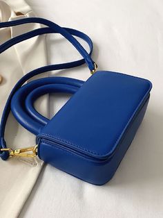 Bag For Love - Minimalist Double Handle Flap Square Bag - Women Satchels Product Description Color Blue Strap Type Chain Strap Type Top Handle Pattern Type Plain Style Fashionable Bag Size Medium Quantity 1 piece Type Square Bag Composition 100% Polyurethane Material PU Leather Size Chart INCH CM Size Bag Width Bag Height Bag Length Strap Length one-size 2.6 3.9 6.3 47.2 Size Bag Width Bag Height Bag Length Strap Length one-size 6.5 10 16 120 Similar Products h2 { text-align: center; } .red-box Trendy Blue Square Box Bag, Blue Square Box Bag For Everyday Use, Blue Square Box Bag For Everyday, Chic Blue Handheld Box Bag, Everyday Blue Square Box Bag, Trendy Blue Box Bag, Blue Office Shoulder Bag With Phone Pocket, Everyday Blue Handheld Box Bag, Everyday Blue Mobile Phone Box Bag