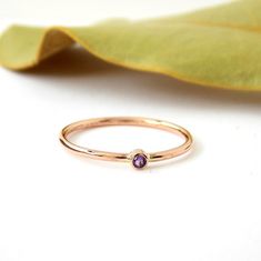 This tiny, simple ring is made in this beautiful rose gold color.  You can choose your choice of birthstone for this ring.  The setting is solid gold while the band is gold-filled.  This ring looks great stacked with several together but also looks amazing on it's own.-Just over 1mm thick-Listing for ONE ring-14K Rose Gold-Filled Band-Solid Rose Gold Setting-2mm Birthstone of your choice**BIRTHSTONES AVAILABLE**January - Almandine GarnetFebruary - AmethystMarch - AquamarineApril - White TopazMay Rose Makeup, Almandine Garnet, Simple Ring, Ring Birthstone, Ring Simple, Gold Filled Ring, Ring Dainty, One Ring, Beautiful Rose