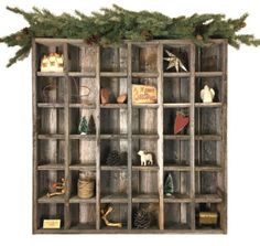 a wooden shelf filled with lots of christmas decorations