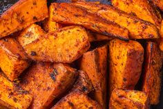 cooked sweet potato wedges on a baking sheet ready to be served in the oven