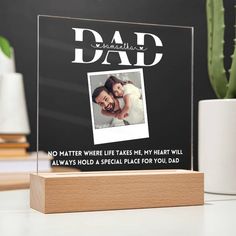 a clear acrylic plaque with the words dad on it and an image of a couple