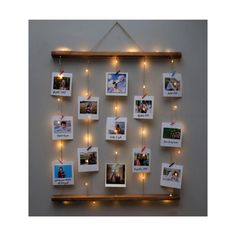 a wall hanging with pictures and lights on it