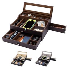 an open wooden box containing three compartments with various items in it, including a cell phone and other electronic gadgets