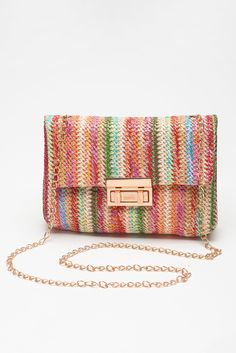 Elevate your style with the TRAVELING GYPSY- Bohemian Woven Gold Chain Shoulder Bag. The intricately woven design adds a touch of bohemian flair, while the shimmering gold chain strap makes a statement. The stylish flap closure keeps your essentials secure, making this bag the perfect blend of bohemian and elegance. Material: 100%Straw Multicolor Spring Bags, Trendy Woven Bags As Fashion Accessory, Spring Multicolor Woven Shoulder Bag, Trendy Multicolor Straw Bag, Trendy Multicolor Crochet Bag, Chic Multicolor Woven Bag, Trendy Multicolor Shoulder Bag With Braided Handles, Chic Multicolor Crochet Shoulder Bag, Trendy Multicolor Crochet Bag With Adjustable Strap