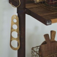 a shelf with some metal items hanging from it