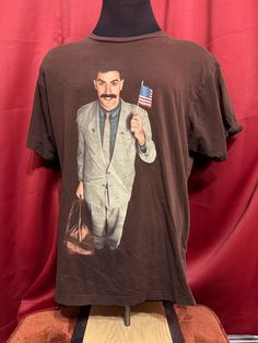 Vintage Borat Movie Tee - Rare  - Y2K vintage  - Movie promo licensed  - Borat graphic  - Borat tagged ripple junction  - Double stitched  Size: XL  29" shoulder to waist 23" armpit to armpit  Good vintage condition No rips or holes  No stains Borat Movie, Brown Grunge T-shirt For Streetwear, Brown Vintage T-shirt For Streetwear, Vintage Fitted Brown T-shirt, Film Tshirt, Vintage Brown Long Sleeve T-shirt, Vintage Cartoon Print Crew Neck T-shirt, Movie Tees, Y2k Vintage