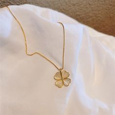 A classic piece for any jewelry collection, this beautiful gold plated four-leaf clover necklace is the perfect gift for any occasion. Each charm hangs on a fine gold plated chain and is polished to bring out its natural luster and shine. Perfect for yourself or as a gift for someone special, this beautiful necklace will make you feel like a lucky charm. Estimated Shipping Time: 5-8 business days 30-day Return Window Composition: Copper Gold Plated Heart Four-Leaf Clover Shape Necklace Classic Jewelry Aesthetic, Clover Leaf Jewelry, Gold Charm Necklace With Flower Shape Clavicle Chain, Clover Necklace Gold, Kalung Aesthetic, Surprise Birthday Decorations, Clover Jewelry, Four Leaf Clover Necklace, Baby Dress Design