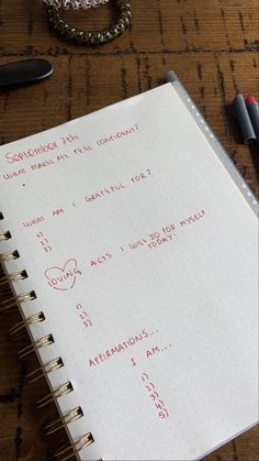 an open notebook with writing on it