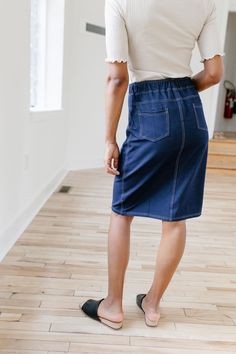 With the look of real denim but the feel of a quality knit, comfort is the key element in our exclusively designed 'Piper 'Skirt. The quick, pull on style with a fabric covered waistband makes this skirt a practical everyday option! Soft, comfortable knit denim fabric Functional Back Pockets 70% Rayon 25% Polyester 5% Spandex Wash Cold Gentle Cycle Hang to Dry Fabric covered elastic waistband Model A Height in Dark Blue 5'5" | Wearing Size Small Wearing 'Finch' Smocked Yoke Cotton Gingham Top in Casual Stretch Pencil Skirt, Medium Wash Knee-length Skirt For Fall, Fall Denim Stretch Skirt, Knee-length Medium Wash Skirt For Fall, Relaxed Casual Denim Skirt For Fall, Casual Relaxed Denim Skirt For Fall, Casual Non-stretch Dark Wash Skirt, Casual High Waist Non-stretch Pencil Skirt, Casual Stretch Mini Pencil Skirt