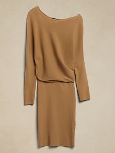 Reimagined in a sultry silhouette, the sweater dress of the season is a modern interpretation of a timeless style.  Crafted from a soft and sustainably-minded yarn, featuring a relaxed cut that's perfect for desk to dinner and dancing.  RELAXED FIT: Stretch Midi Dress For Fall Loungewear, Fall Stretch Midi Dress For Loungewear, Versatile Midi Dress For Fall, Chic Stretch Sweater Dress For Loungewear, Chic Knit Sweater Dress For Daywear, Elegant Fall Dresses For Layering, Chic Knit Sweater Dress For Fall, Elegant Dresses For Fall Layering, Versatile Fall Dresses For Workwear