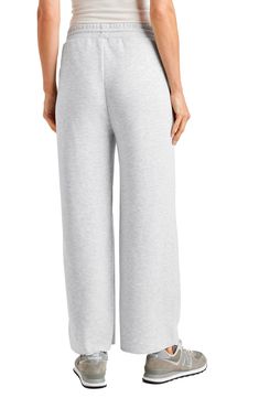 It's all about relaxed weekend vibes with these wide-leg sweatpants in a breezy cropped length. 25" inseam; 22" leg opening; 10 1/2" front rise; 14" back rise Elastic/drawstring waist 65% polyester, 31% viscose, 4% elastane Machine wash, tumble dry Imported Spring Sweatpants For Relaxation With Elastic Waistband, Spring Sweatpants With Elastic Waistband For Relaxation, Comfortable Sweatpants For Spring Relaxation, Solid Wide Leg Pants For Spring Lounging, Solid Color Wide Leg Pants For Spring Lounging, Comfy Wide-leg Spring Sweatpants, Comfy Wide Leg Sweatpants For Spring, Comfy Wide-leg Pants With Elastic Waistband, Solid Color Wide-leg Relaxed Fit Joggers