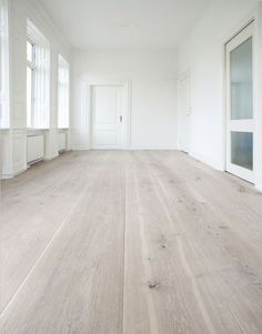 an empty room with white walls and wood floors is featured on the instagram page