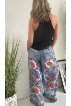 Details Size Chart These hippie print trousers combine the classic look of denim with a unique printed floral design. The elasticated waistband features a drawstring for comfort and style. In addition to its long, wide legs, these pants offer a flattering and stylish silhouette. Length: Ankle-Length Material: Polyester Elasticated waist with ties Style: Vacation Wear Fit Style: Loose Fit @Note: Size: please check measurements carefully Please allow 0.5-1" difference due to manual measurement Different monitor settings means colors may differ slightly 1" = 2.54cm @ Size(inch) Waist Hips Bottom length S 24.02 42.52 42.32 M 24.8 44.09 42.72 L 25.59 45.67 43.11 XL 26.38 47.24 43.5 2XL 27.17 48.82 43.9 3XL 27.95 50.39 44.29 Summer Jeans With Elastic Waistband In Denim Blue, Summer Bohemian Denim Pants, Bohemian Printed Summer Bottoms, Bohemian Printed Bottoms For Summer, Bohemian High Waist Denim Blue Pants, Bohemian Style Denim Blue Jeans For Summer, Casual Wide Leg Floral Print Pants, Bohemian Cotton Jeans For Summer, Bohemian High-waist Denim Blue Pants