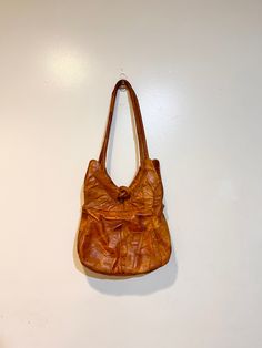 This beautiful leather shoulder bag purse is just what you need for your hippie wardrobe,it is a very large boho style shoulder bag.   Very rare for this type of purse to be this big they are usually 8 in by 8 in. This purse is in excellent vintage condition, it look to have rarely been used if ever.  Absolutely lovely and truly authentic with lots of details you rarely see, I have only seen one other also in my shop!