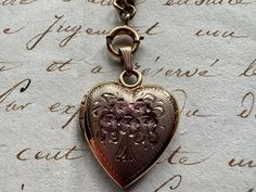 Vintage Rose Gold Jewelry With Intricate Design, Vintage Charm Heart Pendant Necklace For Anniversary, Victorian Pendant Necklace For Anniversary, Anniversary Necklace With Vintage Charm And Heart Pendant, Valentine's Day Vintage Charm Medallion Necklace, Valentine's Day Medallion Necklace With Vintage Charm, Heirloom Jewelry For Valentine's Day, Elegant Brass Locket Necklace For Valentine's Day, Brass Heart Charm Necklace For Wedding