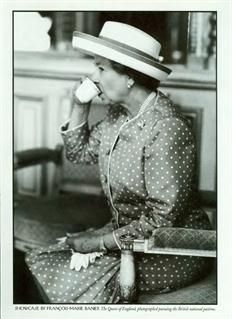 an old black and white photo of a woman drinking from a cup