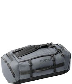 a large gray duffel bag sitting on top of a white floor